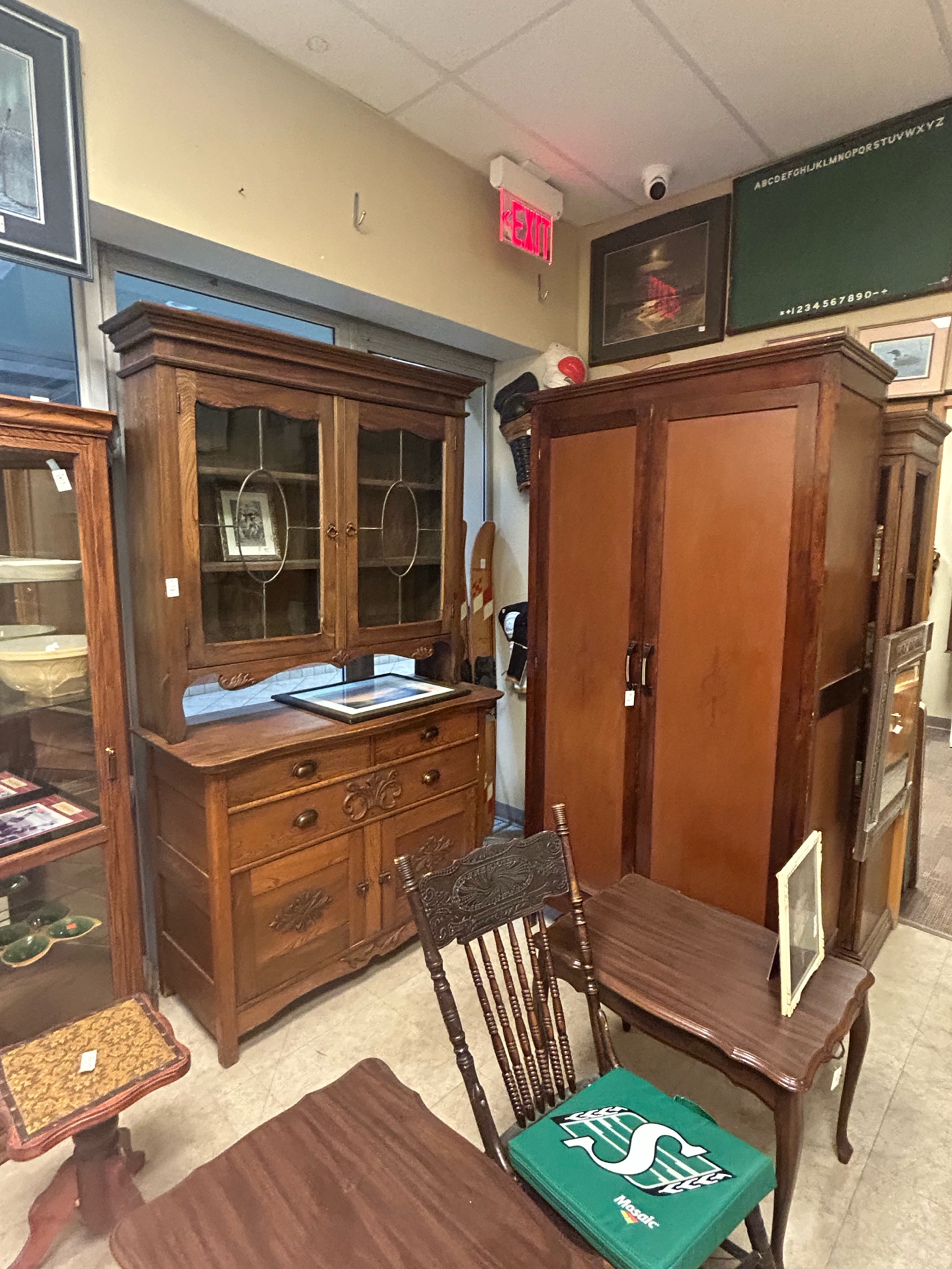 Antique wooden furniture and cabinets at Krave Antiques store in Regina