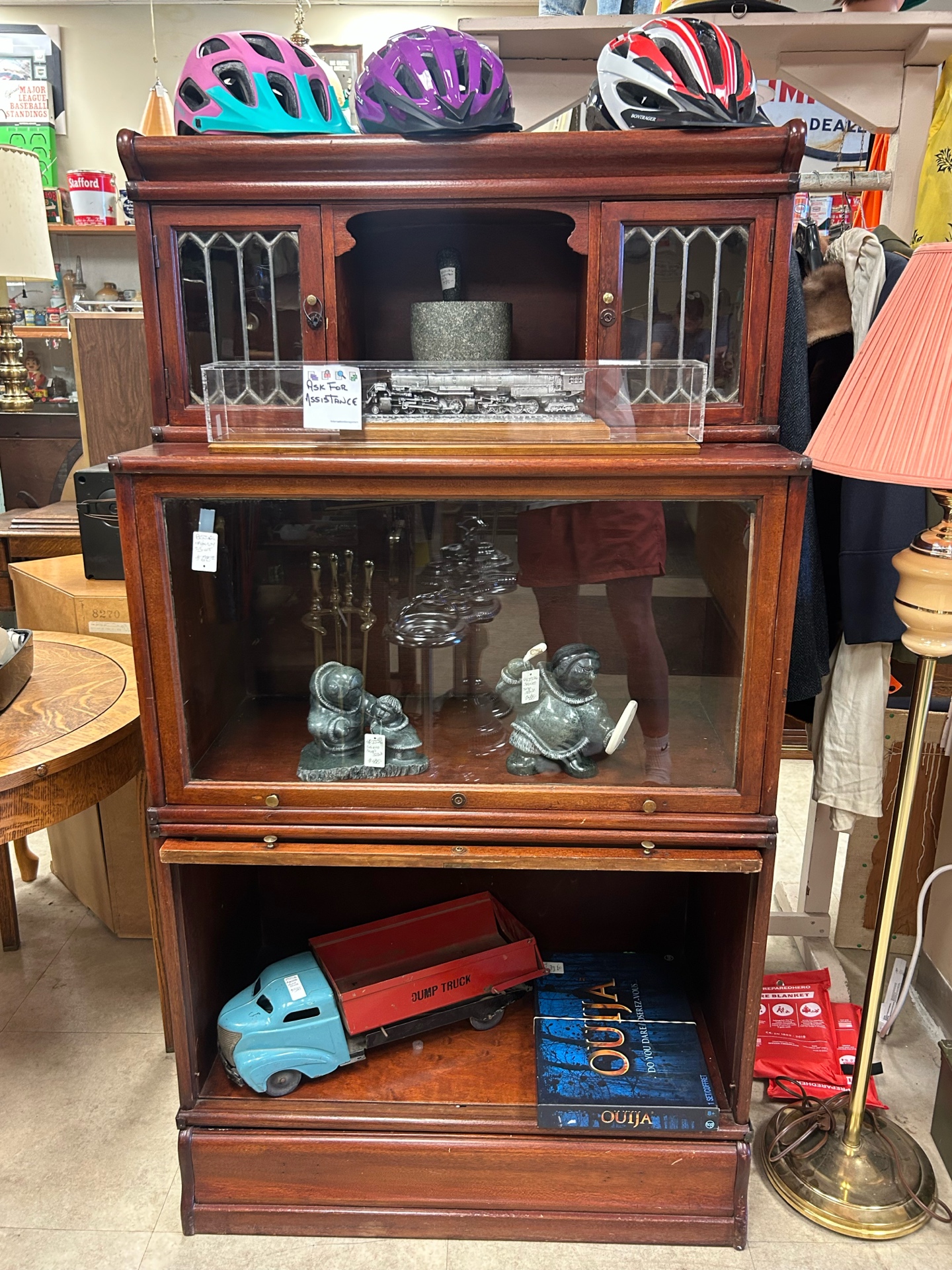 Antique display cabinet with collectables at Krave Antiques Regina
